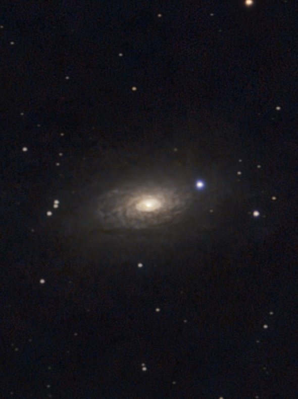 The Sunflower Galaxy (M63), a spiral galaxy with a bright core and faint outer arms.